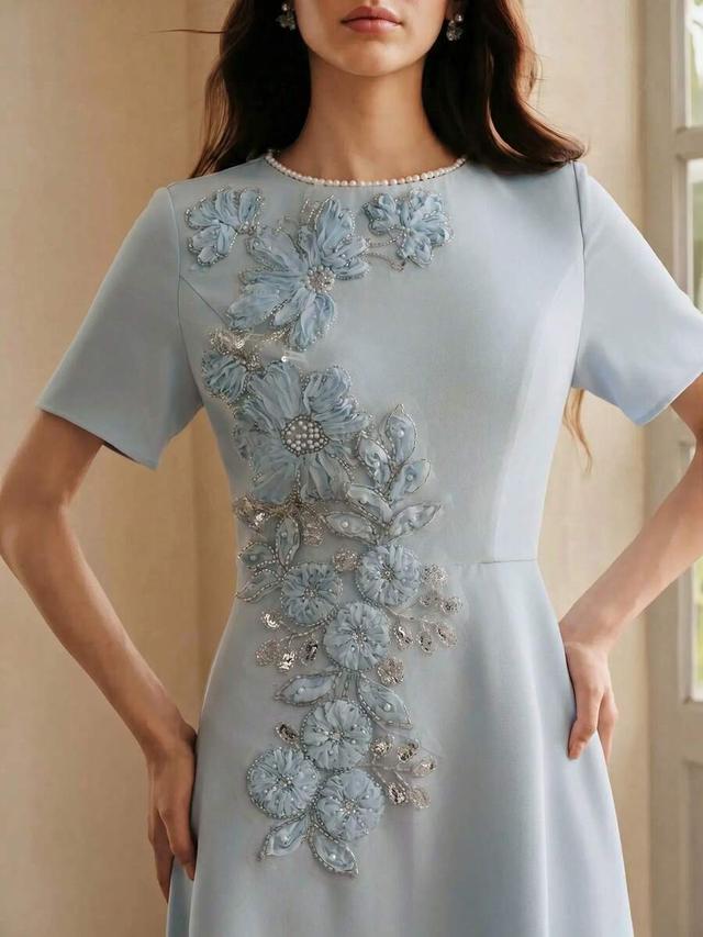blue elegant short sleeve dress with 3d floral appliqué