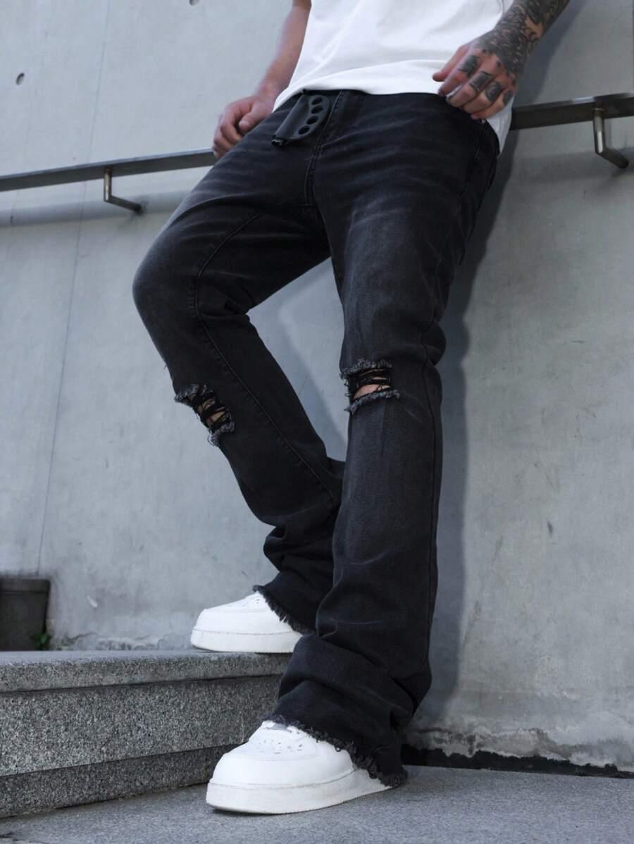 black distressed skinny flare denim jeans with raw hem