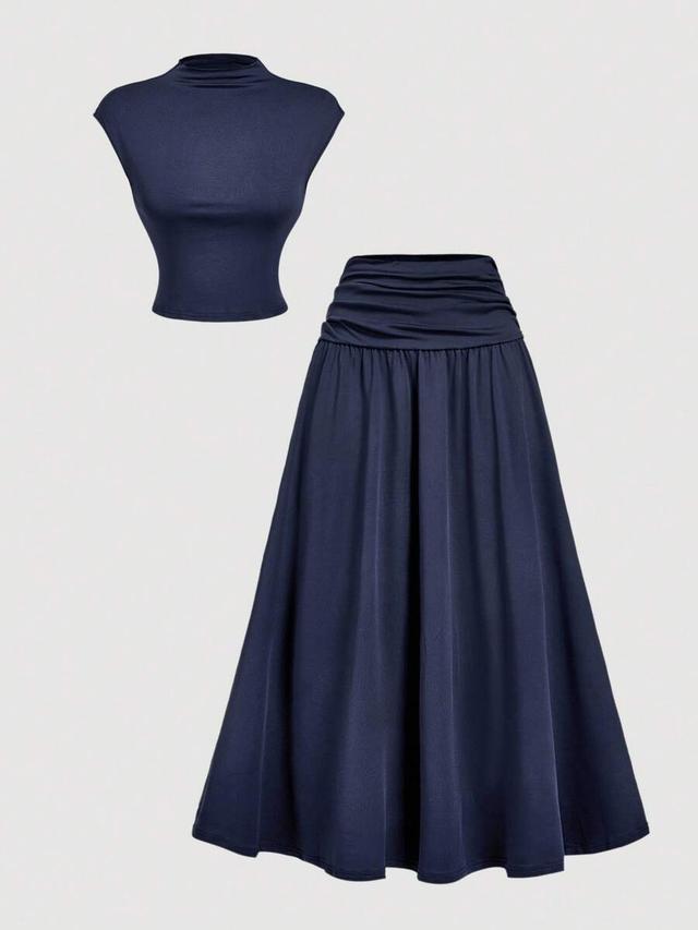 navy blue stand collar top and fitted skirt set