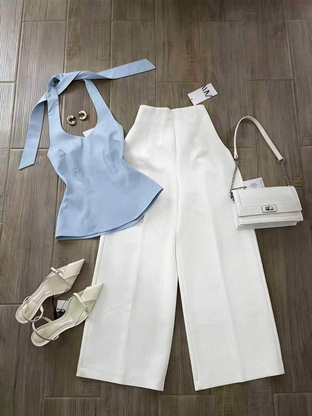 white knotted halter top and wide leg pants