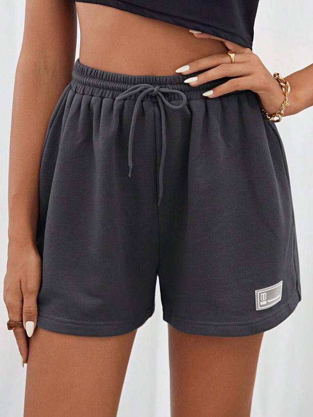 dark grey letter patched drawstring waist track shorts