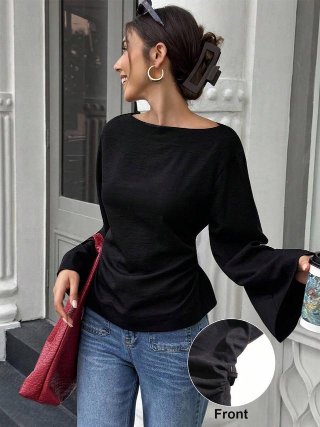solid black boat neck flare sleeve tie-back blouse