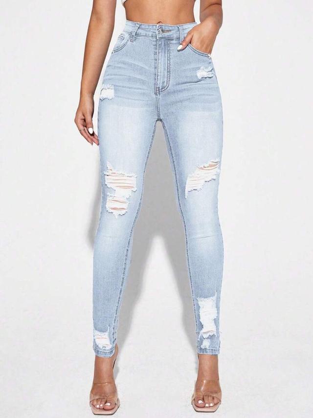 light wash distressed high rise skinny jeans