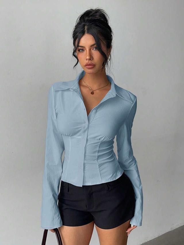 light blue long sleeve pleated waist fitted blouse
