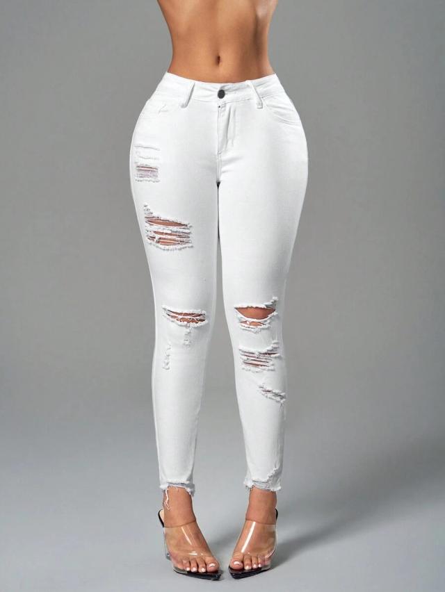 white skinny jeans with distressed details