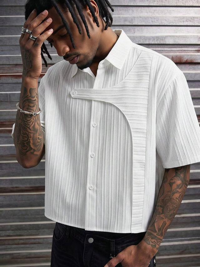 white textured short sleeve casual shirt with asymmetric overlay