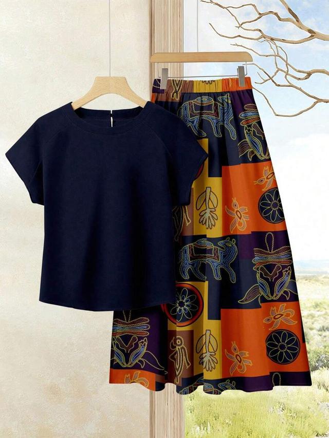 navy solid top and geometric print midi skirt set