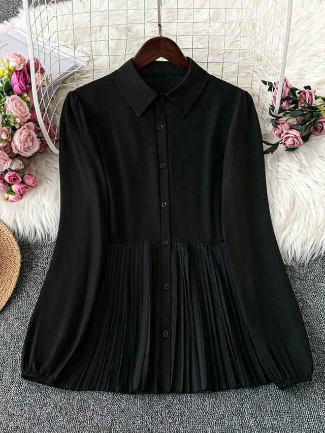 black collared button-down shirt with pleated hem