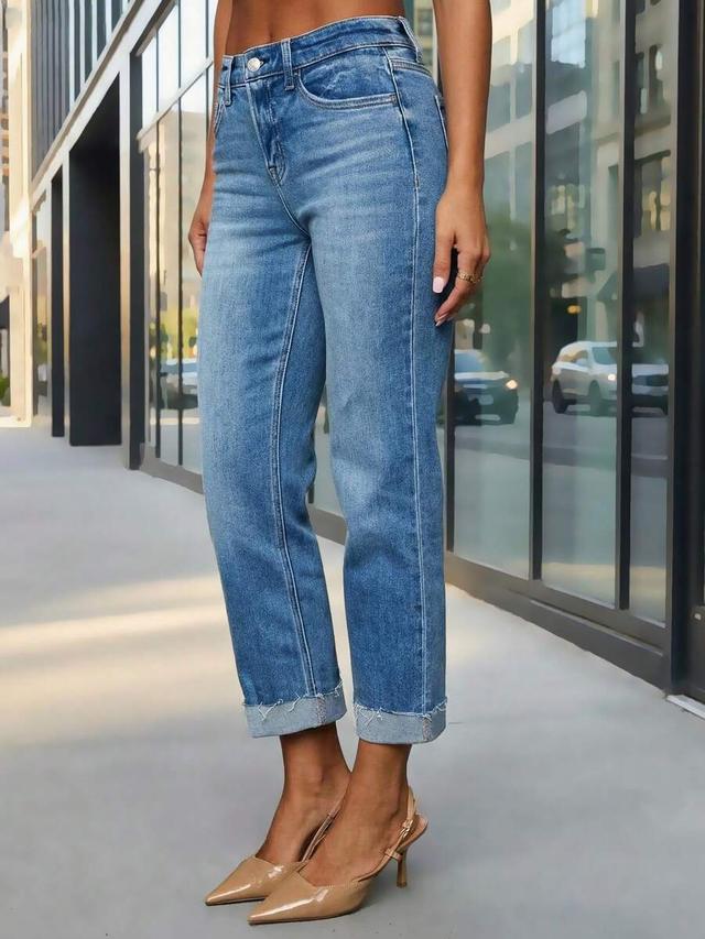 medium wash denim jeans with raw hem