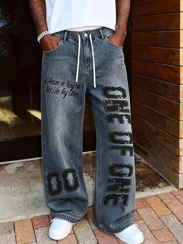 dark denim y2k baggy faded denim trousers with grunge print