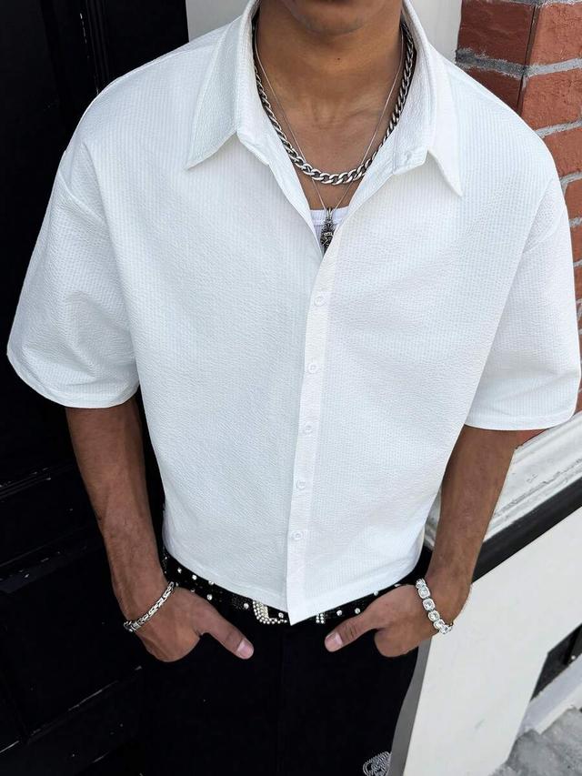 white textured short sleeve button up shirt