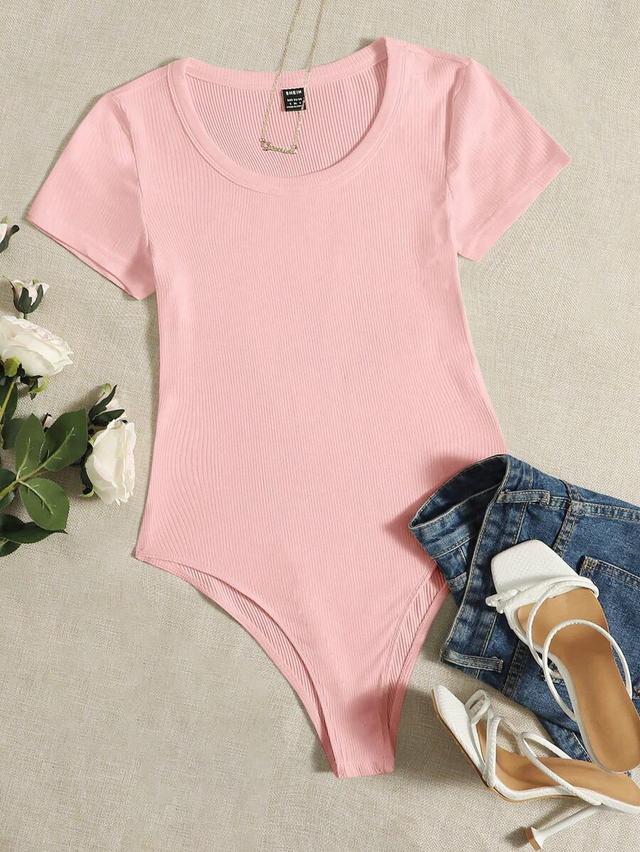 solid pink ribbed knit short sleeve bodysuit
