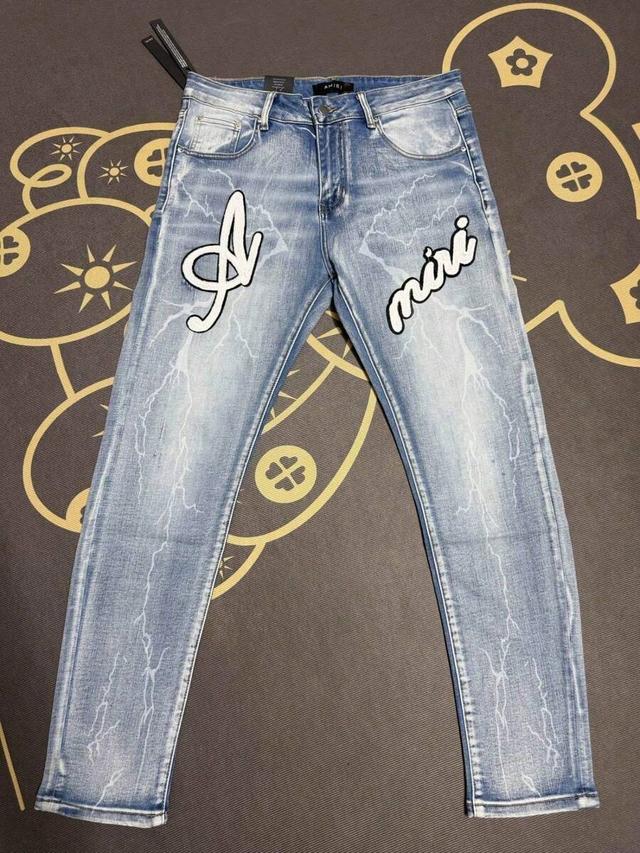 premium craftsmanship distressed denim trousers with detailed embroidery