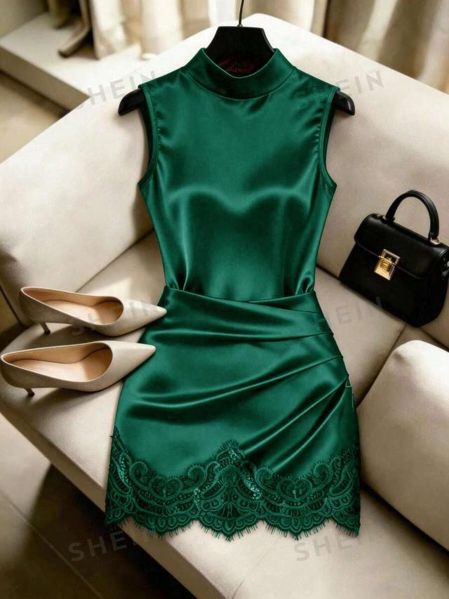 emerald green satin mock neck dress with lace hem