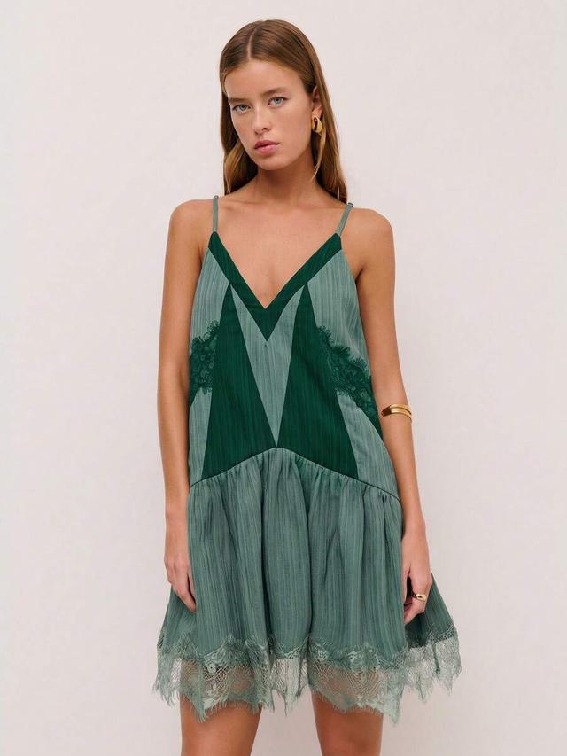 dark green slip dress with lace trim and flared hem