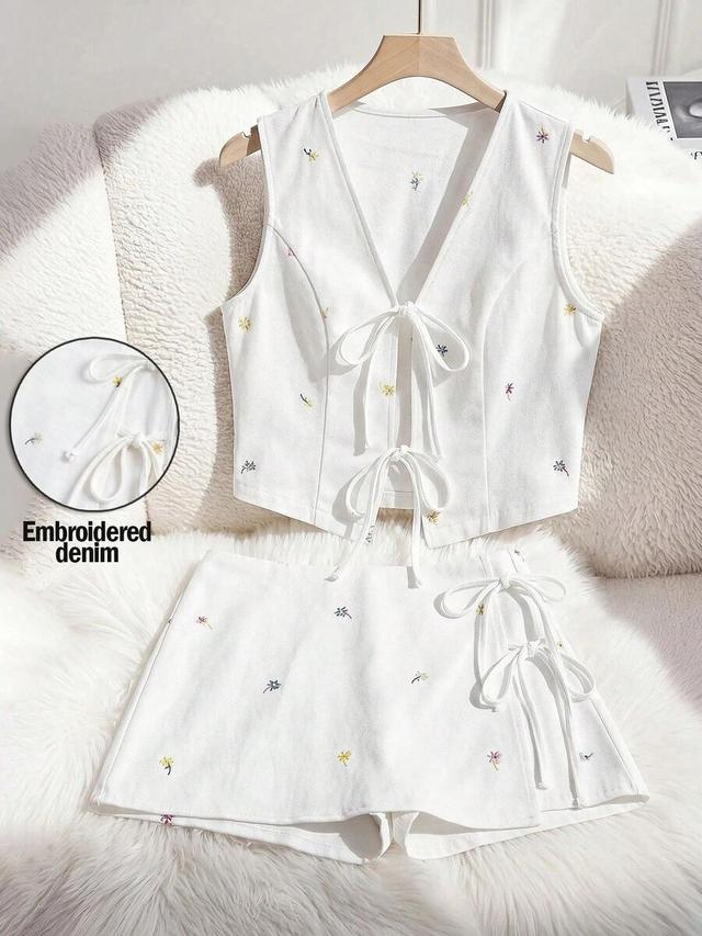 white embroidered denim vest and matching skort set