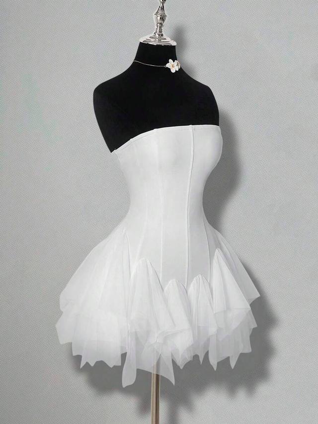 white tube top mini dress with asymmetrical ruffle stitching