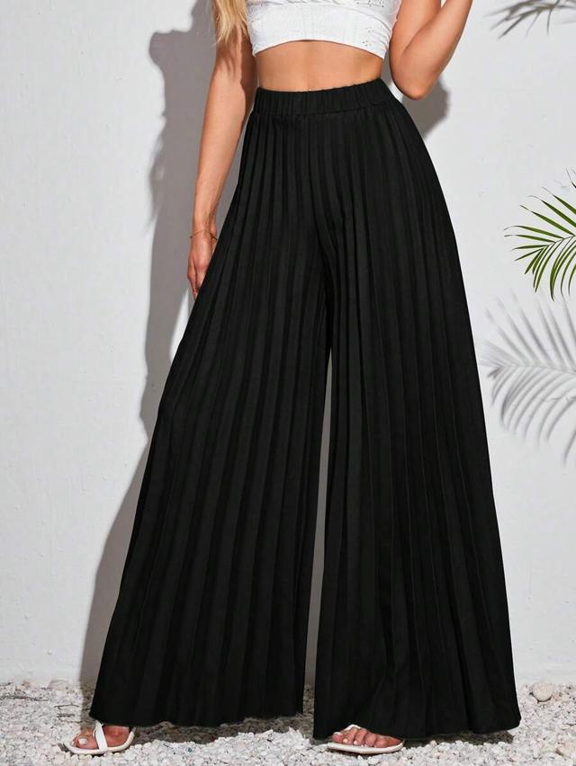 elegant dark green pleated wide-leg trousers