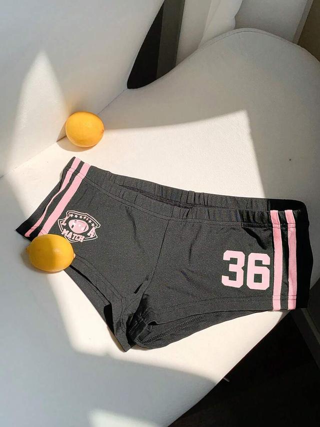 black athletic mini shorts with pink side stripes