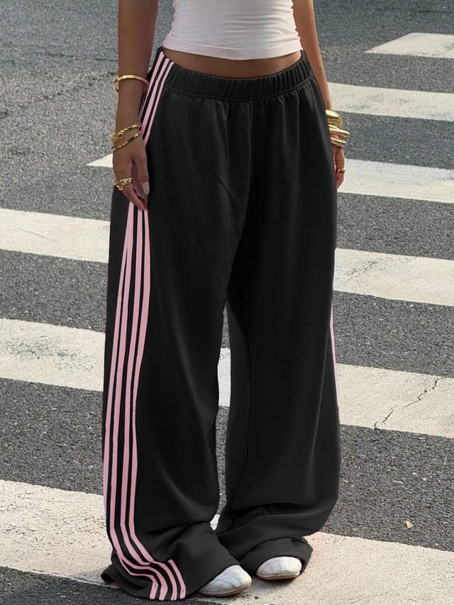 black wide leg sweatpants with pink side stripes
