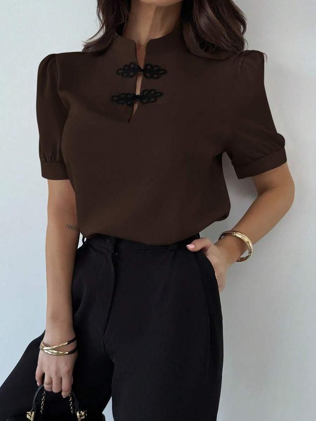 dark brown puff sleeve blouse with frog closures