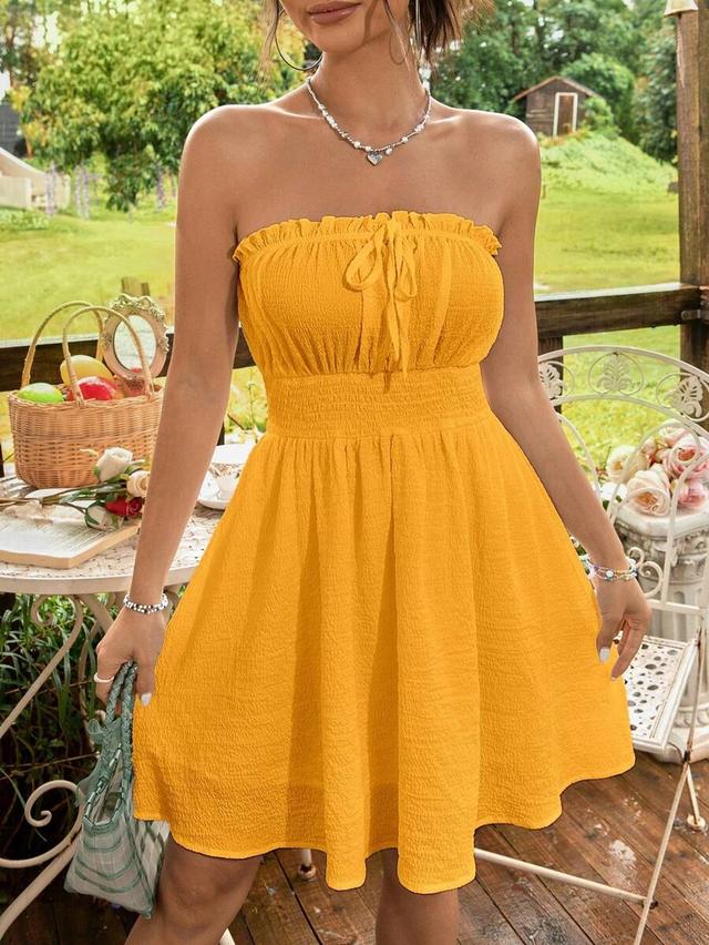 mustard yellow strapless smocked waist mini dress
