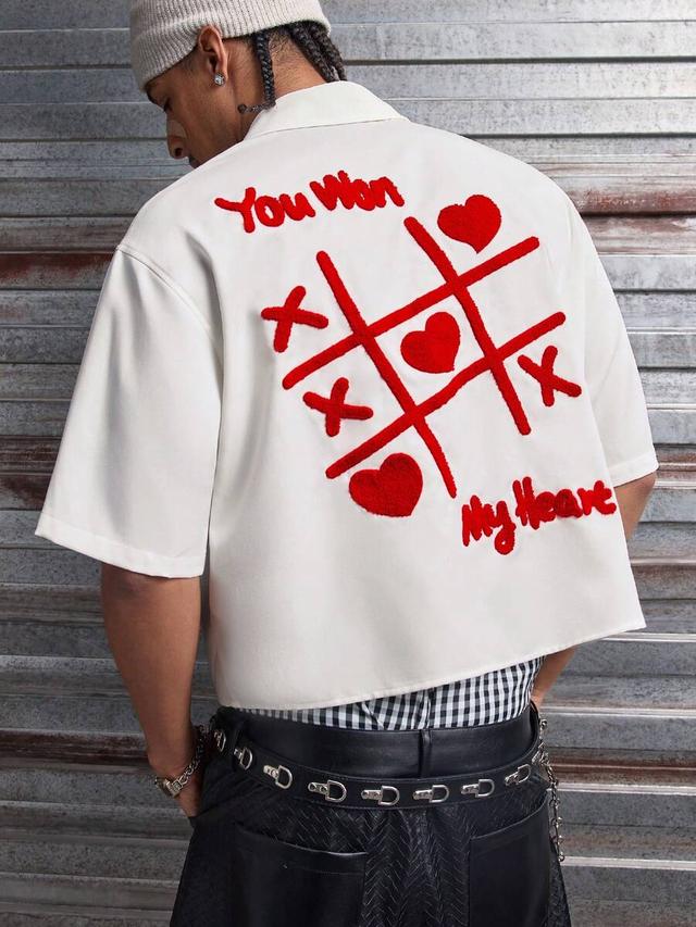 white button-down shirt with red textured heart embroidery