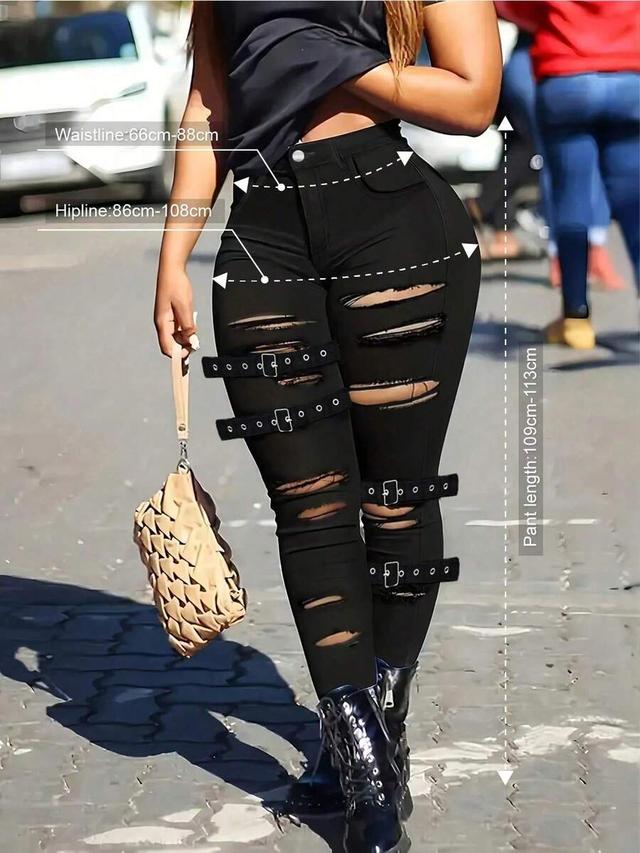 women's black distressed stretch skinny jeans with buckle straps