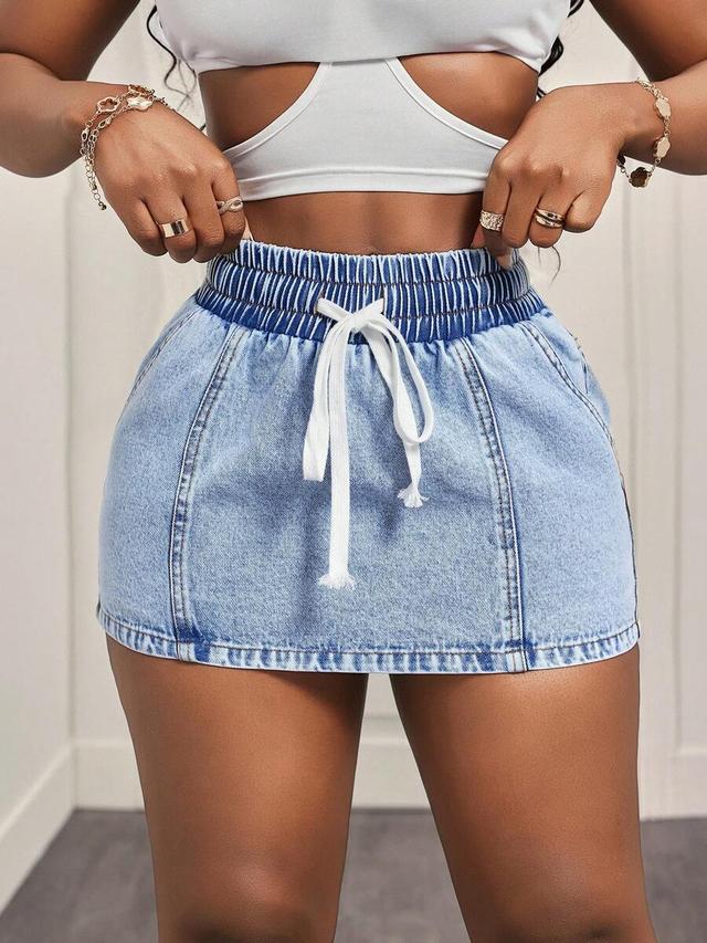light wash denim mini skirt with drawstring waist