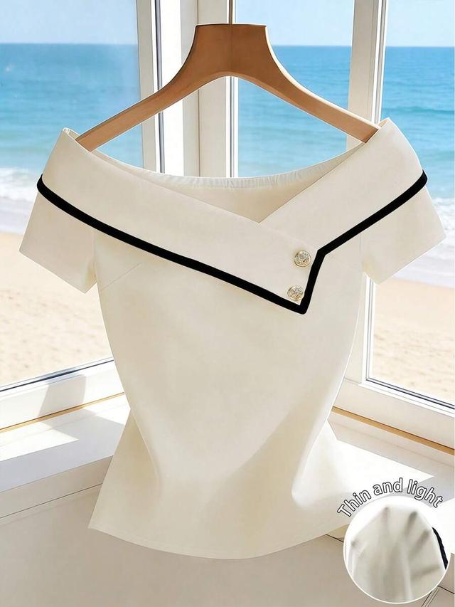 elegant white asymmetric collar blouse with black trim