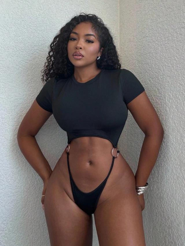 black sporty cutout bodysuit with circular ring details