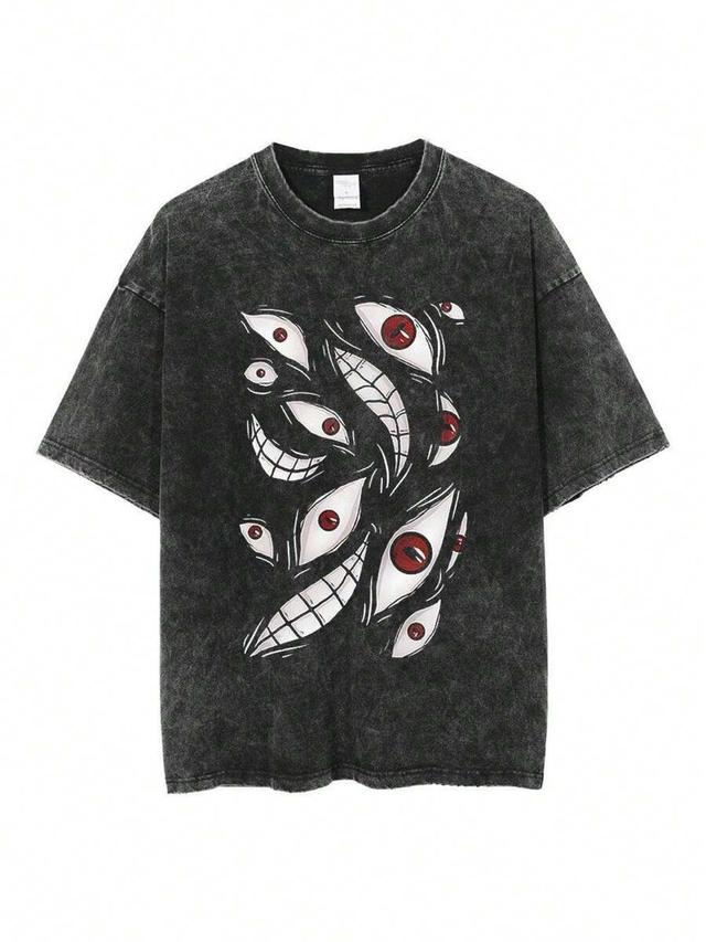 washed black oversized t-shirt with eye and smile graphics