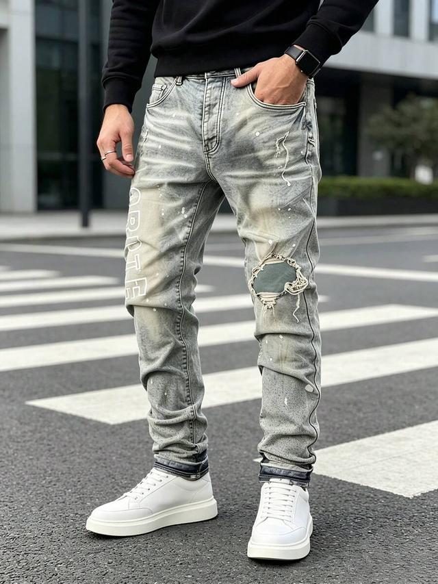 men grey stretch denim jeans with splash ink print