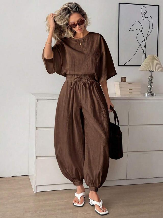 brown batwing sleeve top and tapered leg pants set