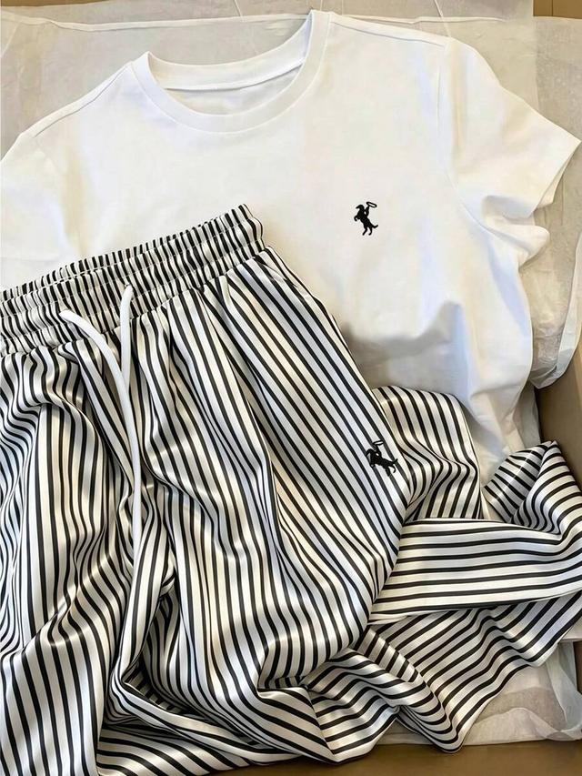 embroidered crew neck short sleeve top and striped pants
