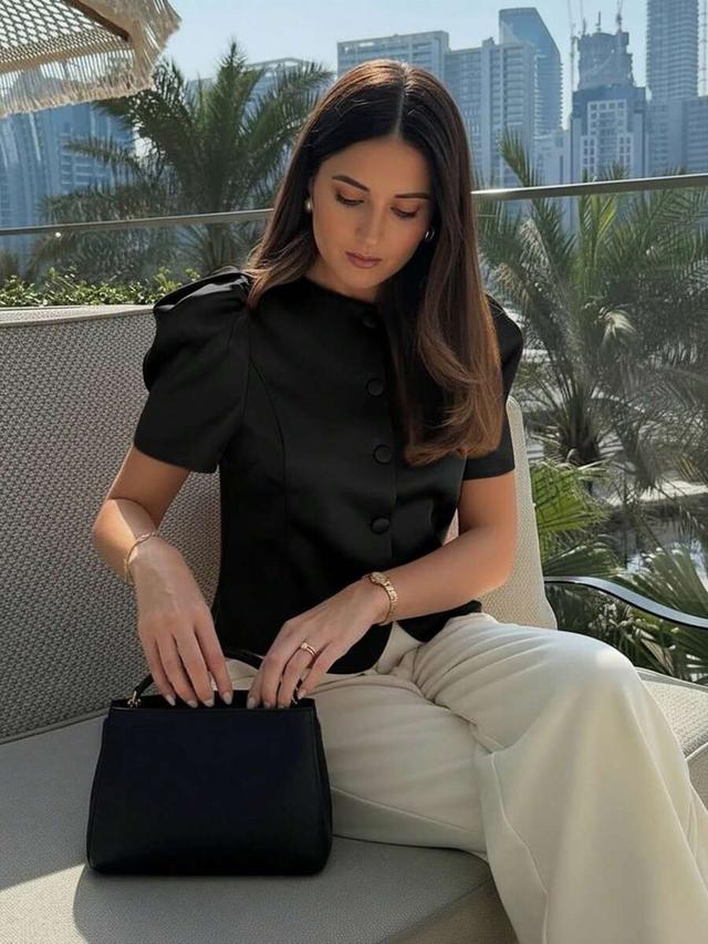 women's black bubble sleeve button-up top