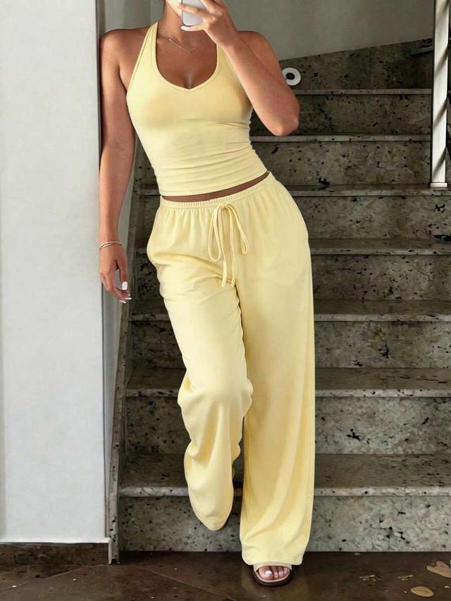 butter yellow sleeveless cropped top and wide-leg pants set