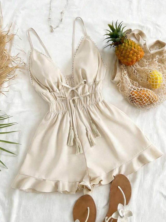 beige spaghetti strap romper with tassel lace-up detail