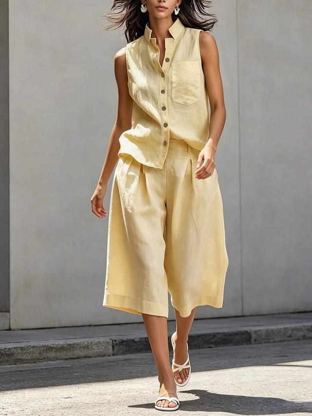 yellow sleeveless button-up shirt and loose shorts set