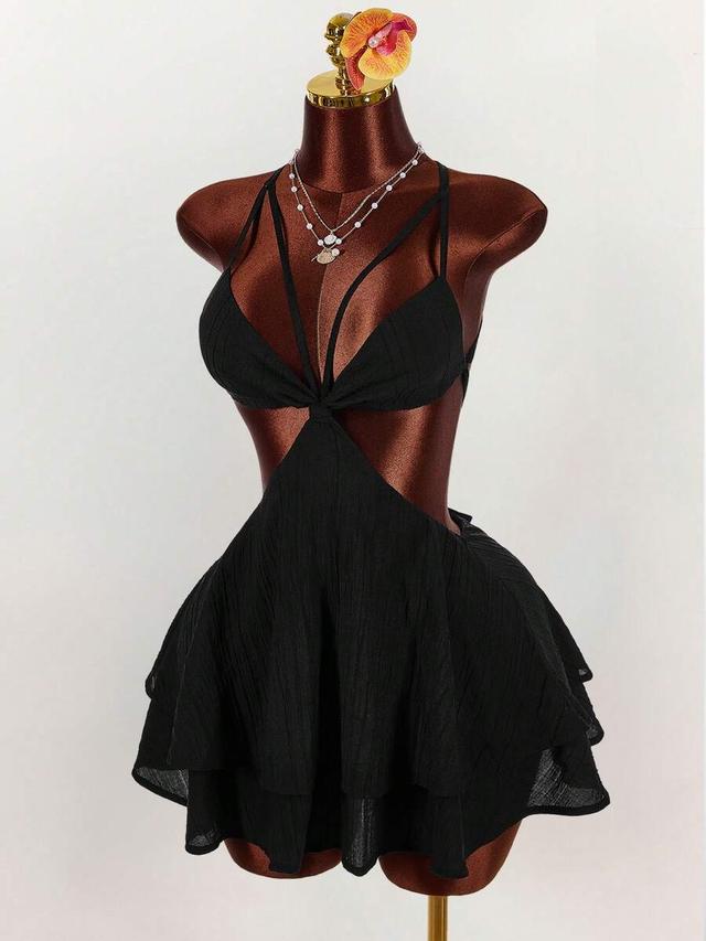 black backless mini dress with tiered ruffle skirt