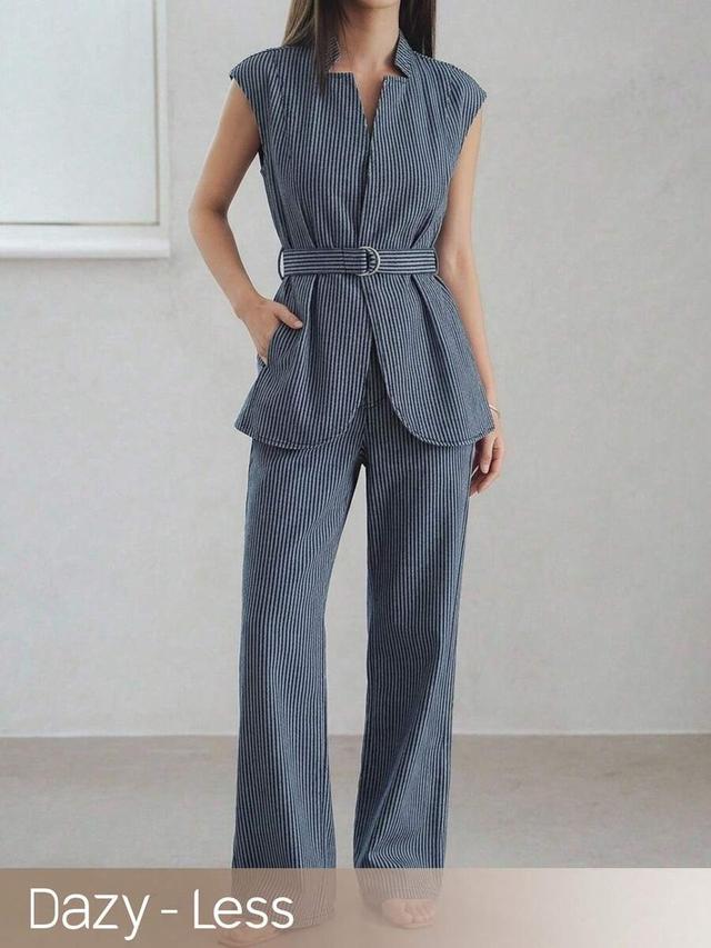 navy pinstripe sleeveless belted jacket and matching trousers