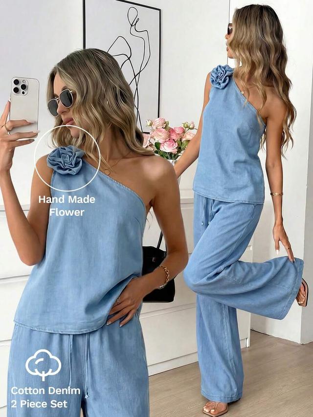 light blue denim one-shoulder top with matching wide-leg trousers