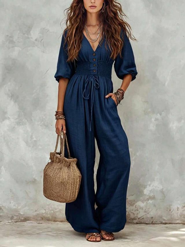 navy blue linen blend v-neck jumpsuit with smocked waist