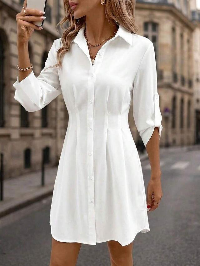 white elegant long sleeve button-up shirt dress
