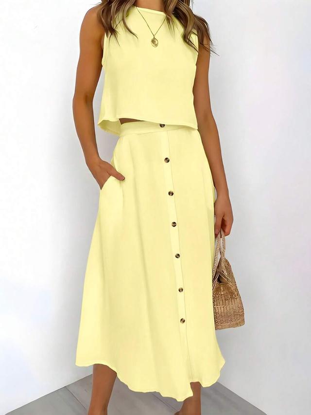 yellow sleeveless top and button front a-line skirt