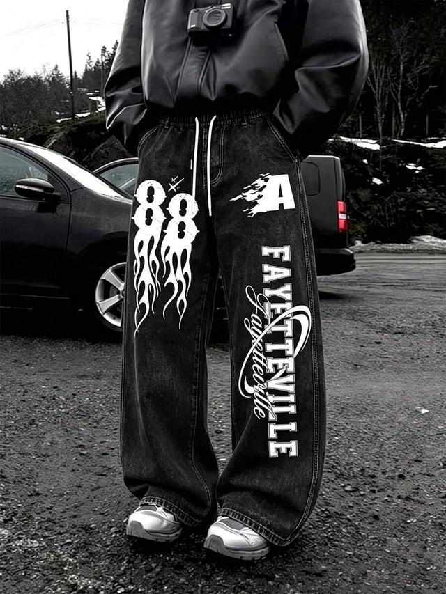 black wide leg denim pants with graphic print