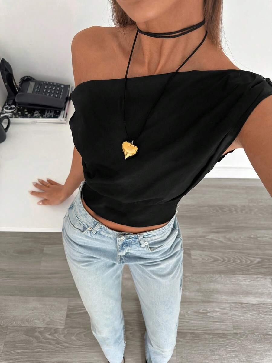 black asymmetric ruched cropped top
