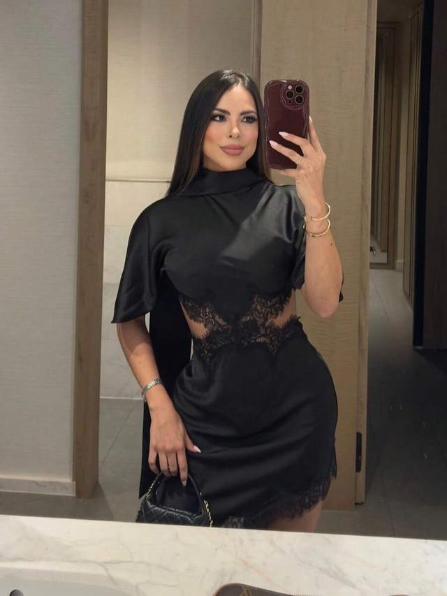 black satin mini dress with lace cutouts