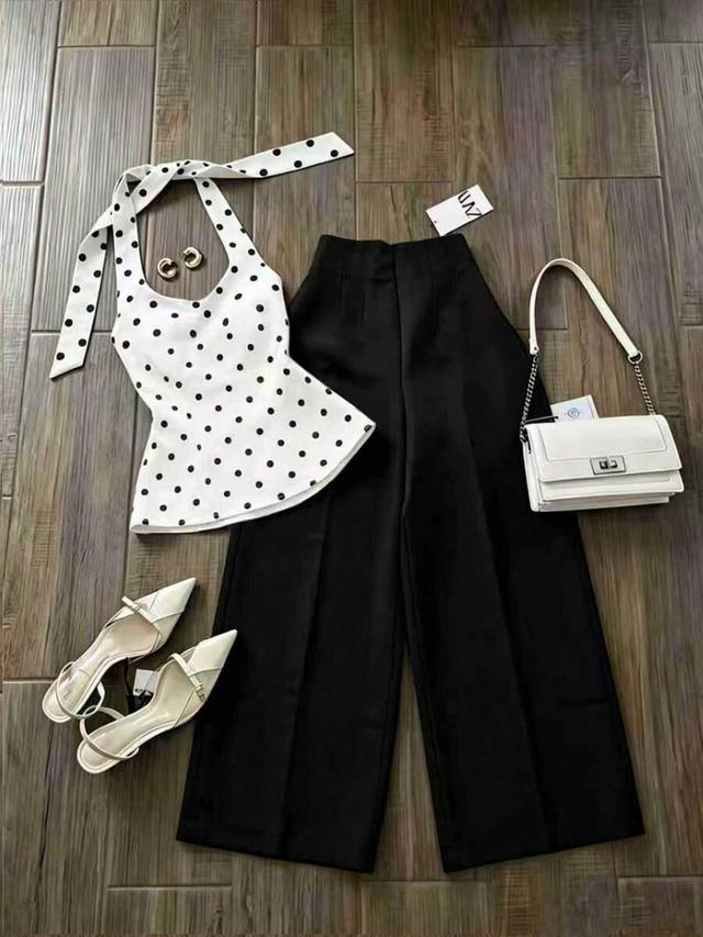 black polka dot halter neck top and solid trousers set