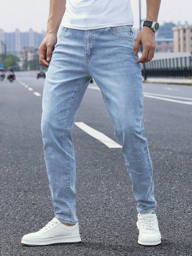 light wash tapered straight leg denim jeans